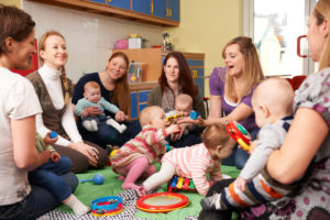 Group Of Mothers With Babies At Playgroup